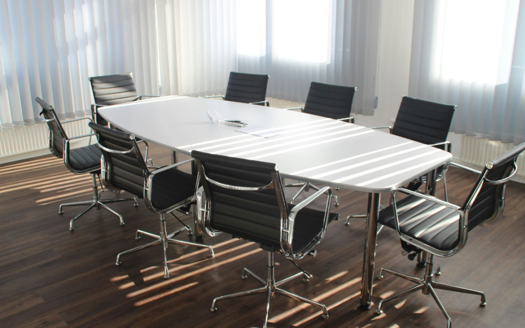 A table and chairs in a meeting room to represent your potential startup's board of directors.