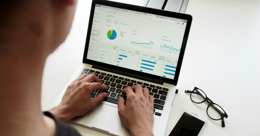 a laptop showing data analysis to represent the takeaways from this list of why startups fail. 